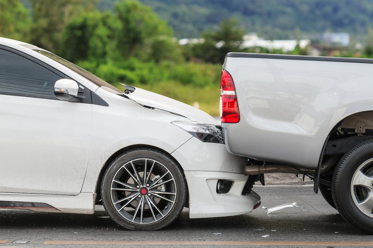 "Technician meticulously working on collision repair in our advanced facility."